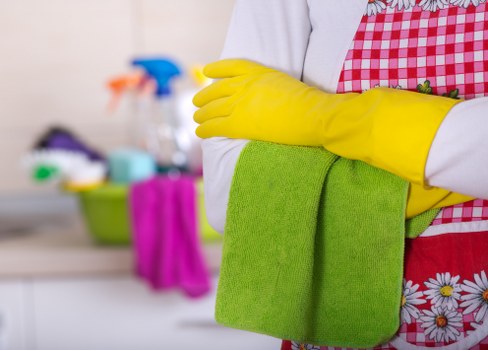 Professional carpet cleaners following safe working procedures