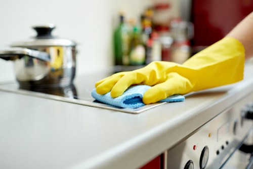 Trained carpet cleaning technician using safe methods and PPE
